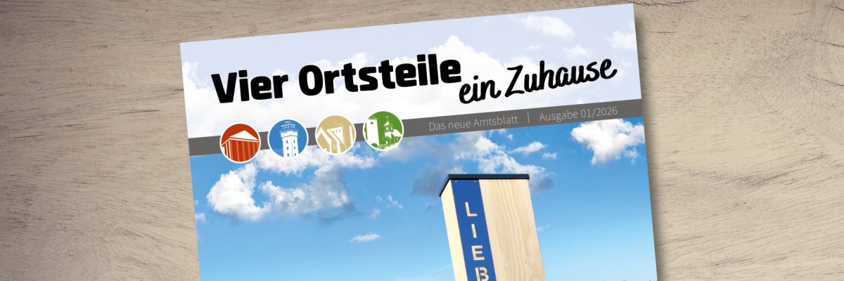 Ausgabe des Amtsblattes auf einem Holzhintergrund